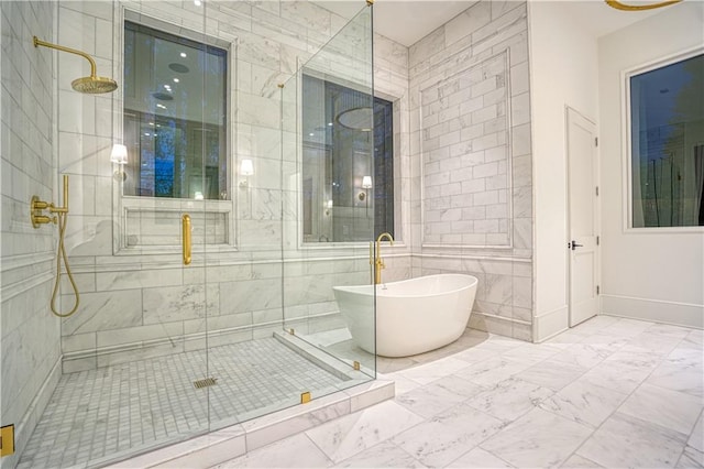 bathroom featuring tile walls and plus walk in shower