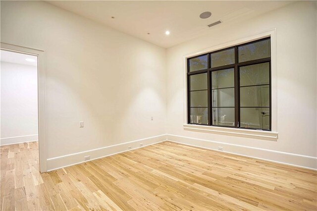 spare room with light hardwood / wood-style floors