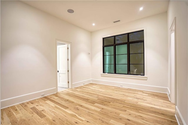 unfurnished room featuring light wood-type flooring