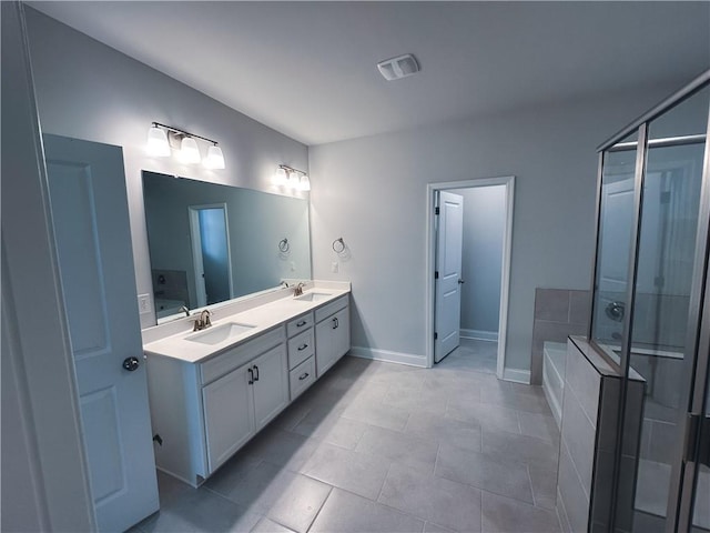 bathroom featuring vanity, shower with separate bathtub, and tile patterned floors