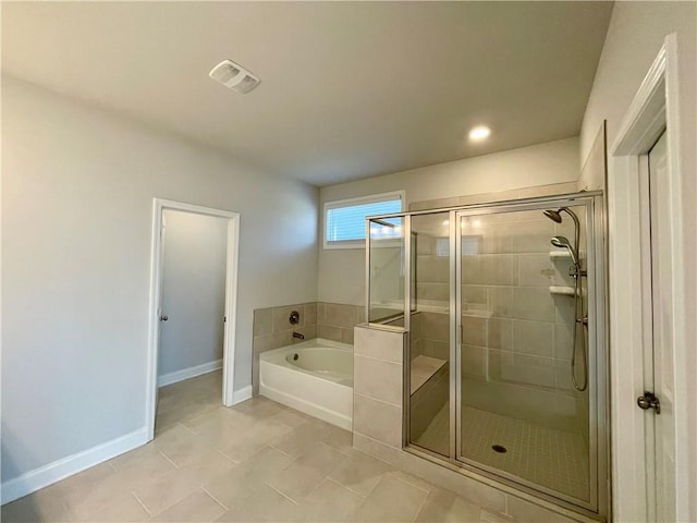 bathroom with plus walk in shower and tile patterned flooring