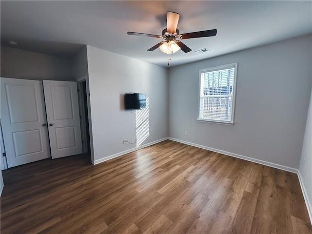 unfurnished bedroom featuring ceiling fan and wood-type flooring