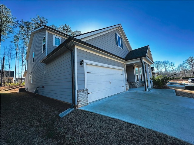 view of home's exterior with a garage