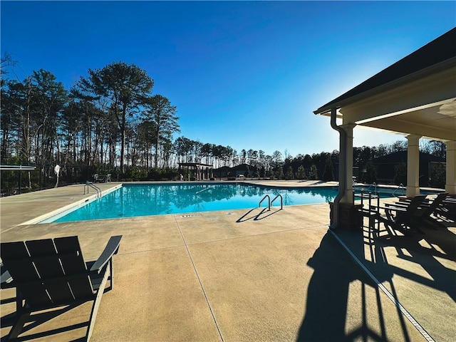 view of swimming pool with a patio area