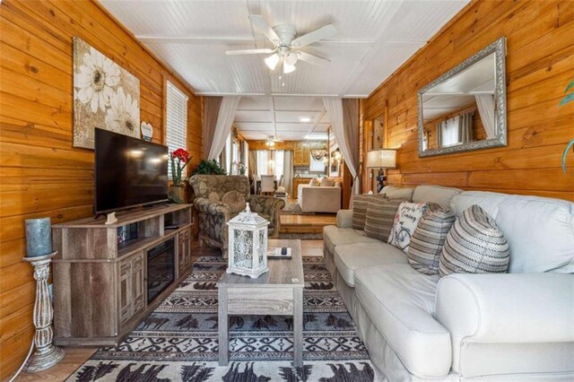 65 Bear Mountain Trl, Cleveland, GA 30528 - living room featuring wood finished floors, wood walls, and ceiling fan