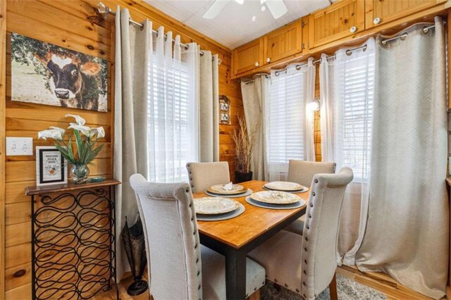 65 Bear Mountain Trl, Cleveland, GA 30528 - dining space with a healthy amount of sunlight, a ceiling fan, and wood walls