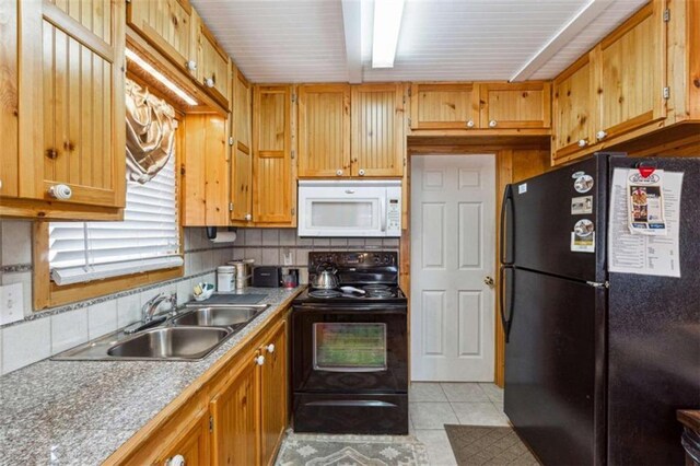 65 Bear Mountain Trl, Cleveland, GA 30528 - kitchen with light tile patterned floors, backsplash, black appliances, and a sink