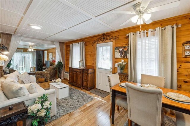 65 Bear Mountain Trl, Cleveland, GA 30528 - living area featuring wooden walls, a ceiling fan, light wood-style floors, and a healthy amount of sunlight