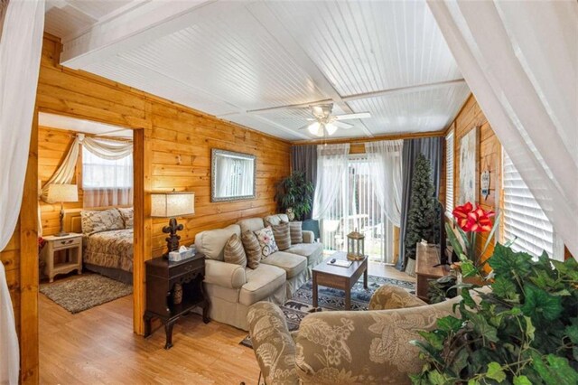 65 Bear Mountain Trl, Cleveland, GA 30528 - living room with a wealth of natural light, wood finished floors, a ceiling fan, and wood walls