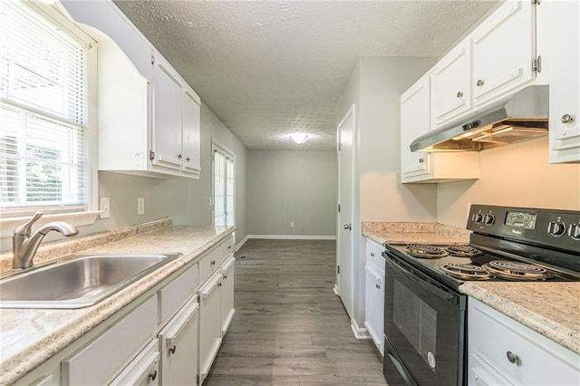 kitchen with white cabinets, a textured ceiling, black range with electric stovetop, and dark wood-type flooring