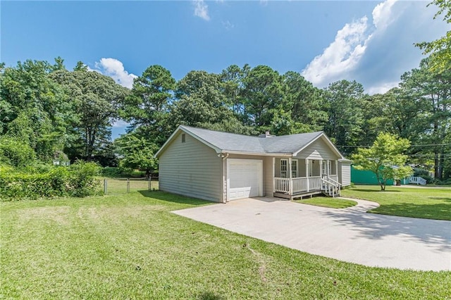 view of front facade featuring covered porch, a garage, and a front lawn