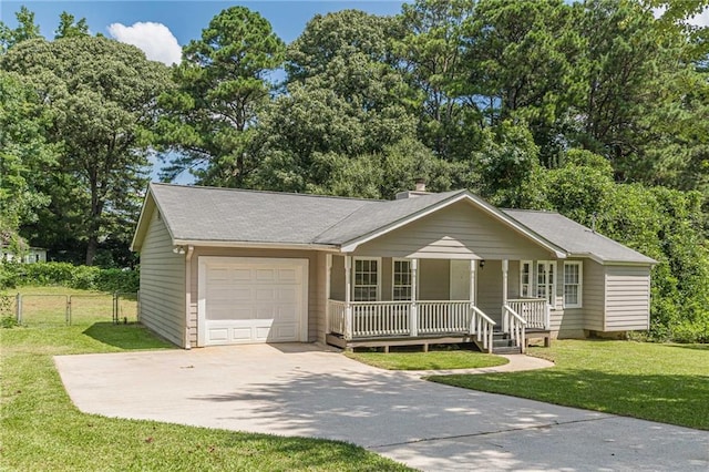 ranch-style home with a front lawn, a porch, and a garage