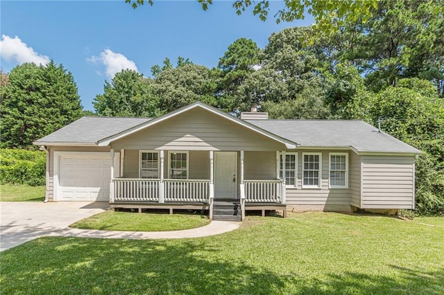 ranch-style house featuring covered porch, a front yard, and a garage