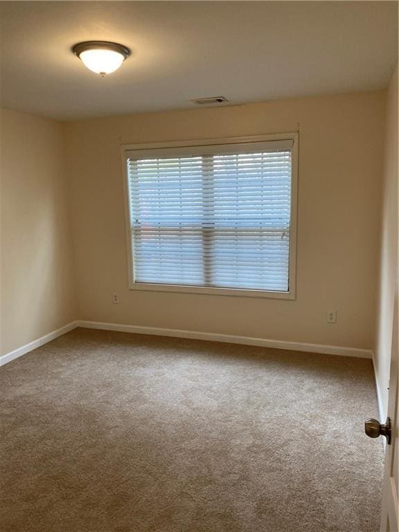 unfurnished room featuring carpet flooring