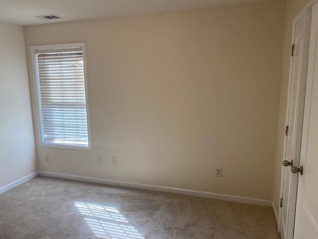 empty room with light colored carpet