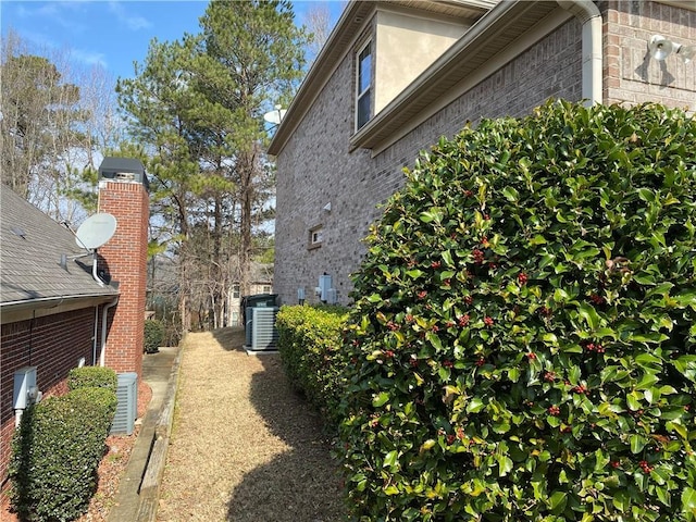 view of property exterior featuring central AC unit