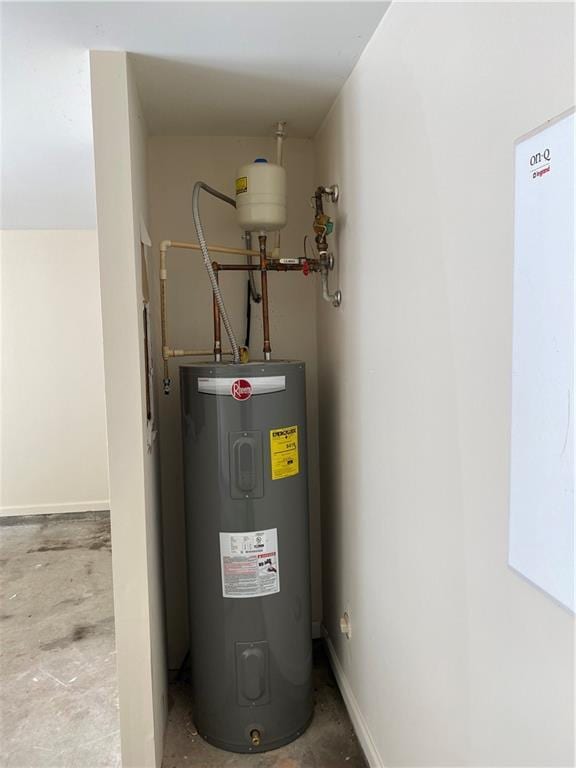 utility room featuring water heater