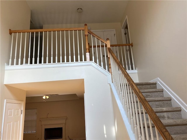 stairs featuring a towering ceiling