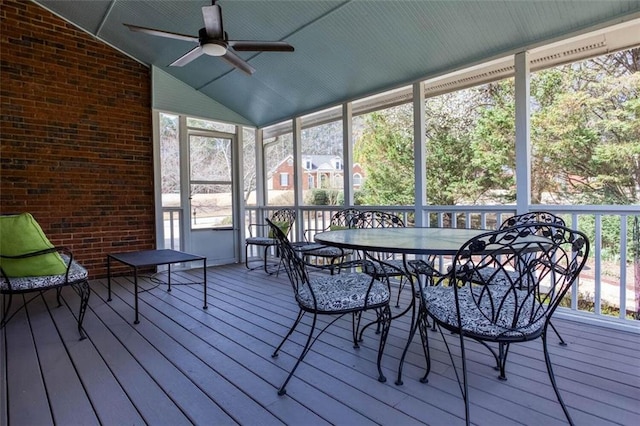 sunroom with a ceiling fan and lofted ceiling