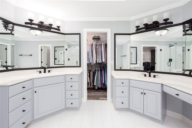 full bathroom featuring a sink, two vanities, and ornamental molding