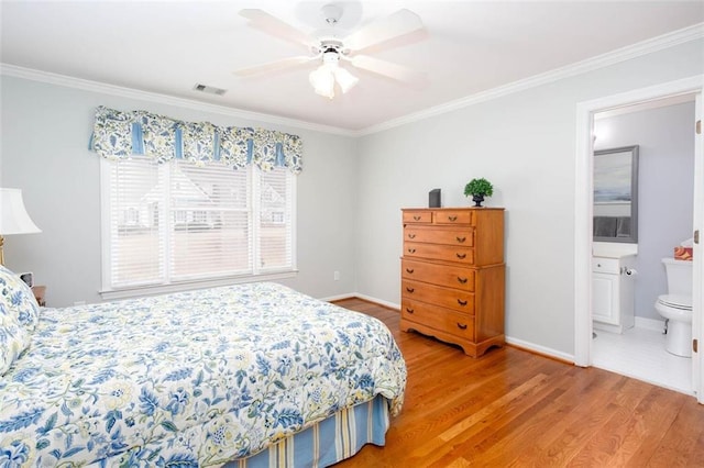 bedroom featuring crown molding, baseboards, visible vents, and light wood-type flooring