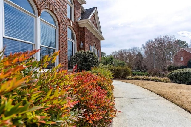 view of side of property with brick siding