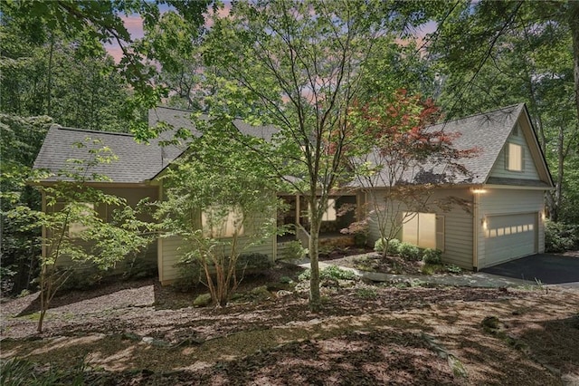 77 Crabapple Cir, Big Canoe, GA 30143 - view of front of home with a shingled roof, an attached garage, and asphalt driveway
