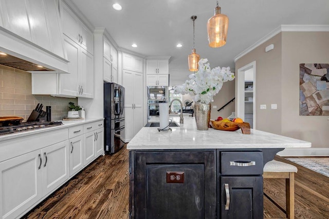1120 Cordia Ave NW, Atlanta, GA 30318 - kitchen with appliances with stainless steel finishes, premium range hood, dark wood finished floors, white cabinetry, and tasteful backsplash