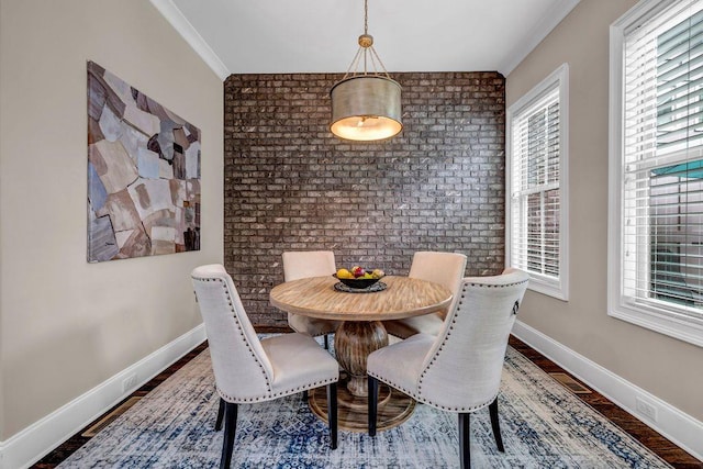 1120 Cordia Ave NW, Atlanta, GA 30318 - dining area featuring wood finished floors, baseboards, and brick wall