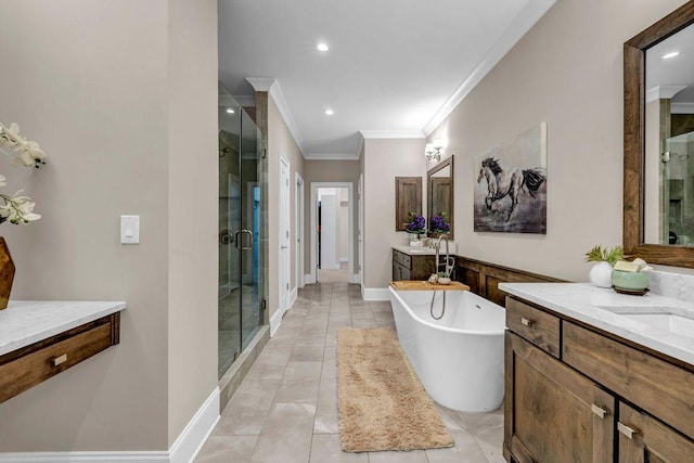 1120 Cordia Ave NW, Atlanta, GA 30318 - bathroom with crown molding, a shower stall, two vanities, a soaking tub, and recessed lighting