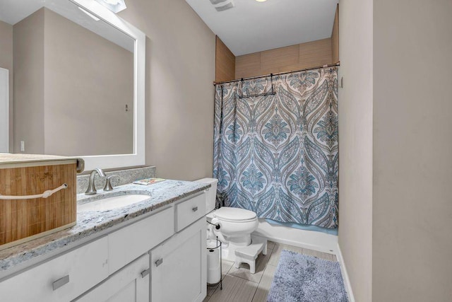 1120 Cordia Ave NW, Atlanta, GA 30318 - bathroom featuring vanity, toilet, tile patterned flooring, and shower / bath combo