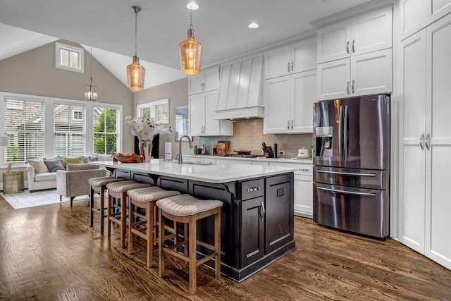 1120 Cordia Ave NW, Atlanta, GA 30318 - kitchen with appliances with stainless steel finishes, a breakfast bar, a sink, dark wood-style flooring, and white cabinetry