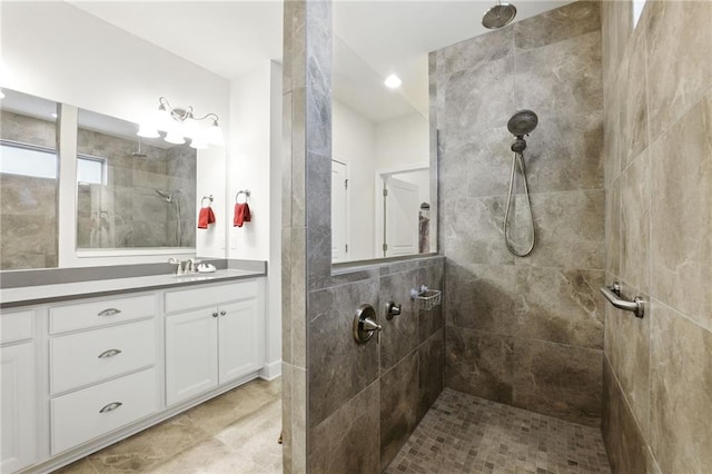 full bathroom with walk in shower and vanity