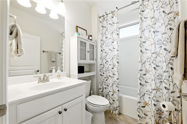 bathroom with toilet, tile patterned flooring, vanity, and shower / bath combination with curtain