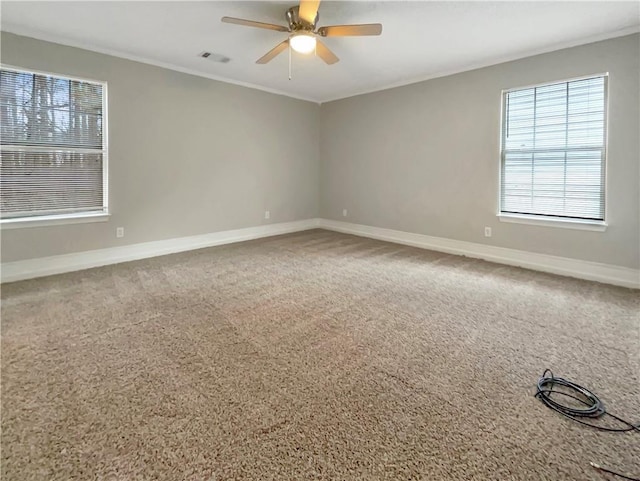 empty room featuring carpet flooring and ceiling fan