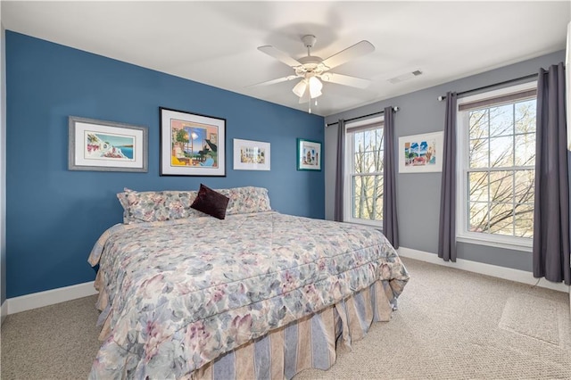 bedroom with ceiling fan and carpet flooring