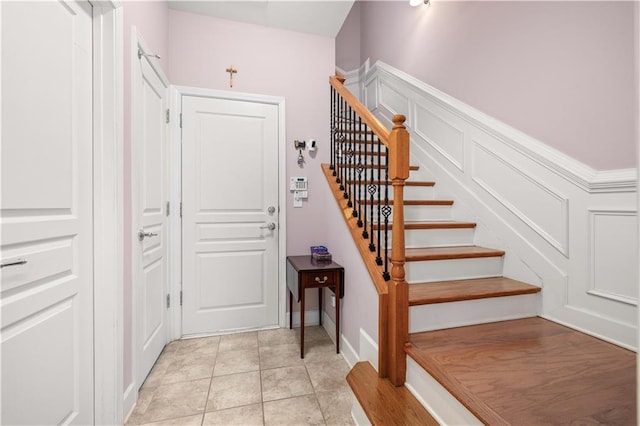 staircase with tile patterned flooring