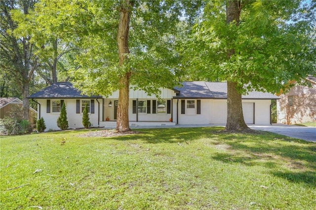 ranch-style house with a front lawn and a garage