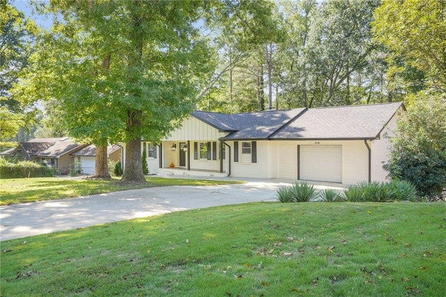 ranch-style home featuring a front yard and a garage