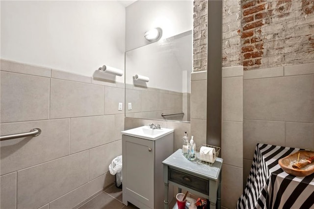 bathroom with tile walls and vanity