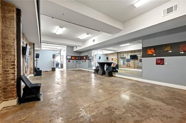 garage featuring baseboards and visible vents