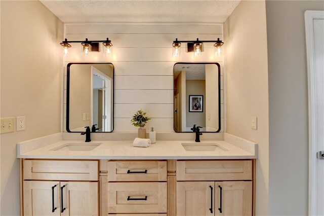 bathroom featuring vanity and a textured ceiling