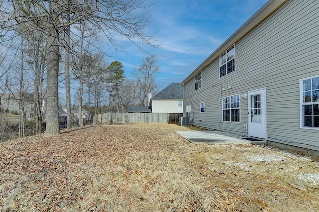 view of yard featuring cooling unit and a patio area