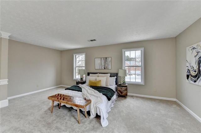 carpeted bedroom with a textured ceiling