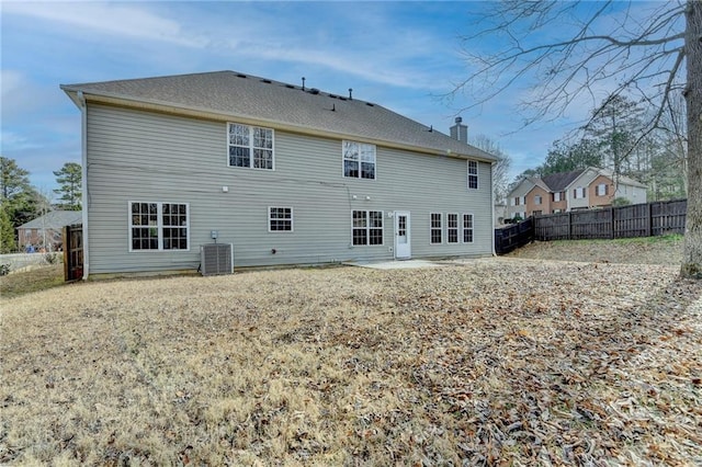 back of property featuring cooling unit and a patio