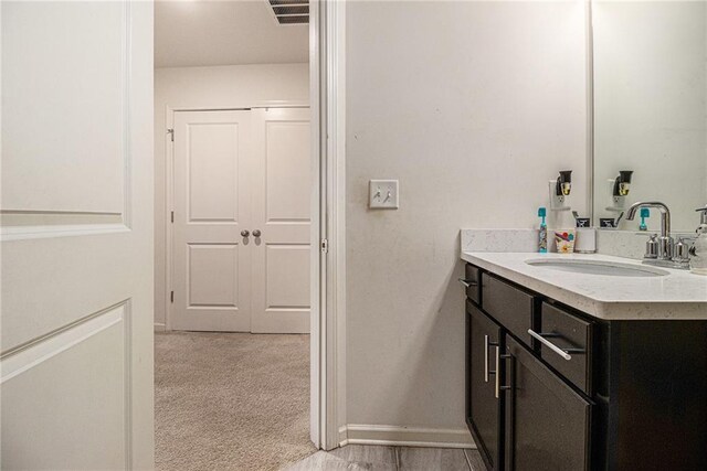bathroom featuring visible vents and vanity