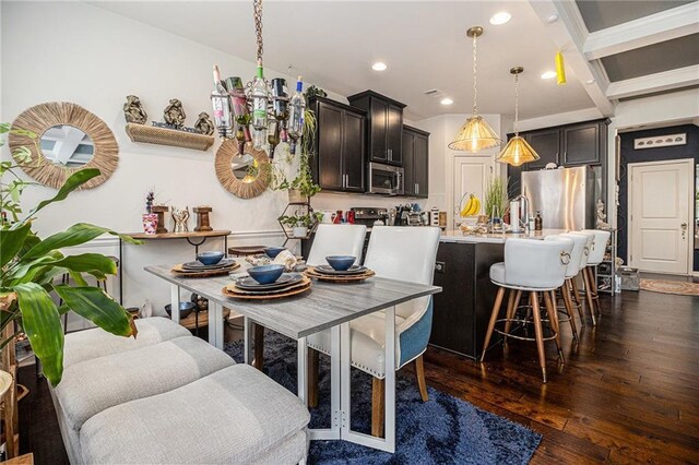 dining room with recessed lighting, a chandelier, and dark wood-type flooring