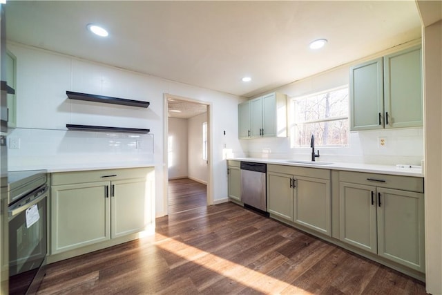 kitchen featuring oven, dark wood-type flooring, a sink, recessed lighting, and dishwasher