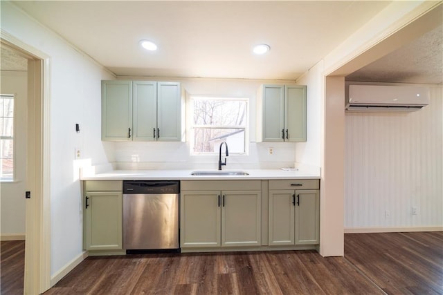 kitchen featuring a sink, stainless steel dishwasher, an AC wall unit, and a wealth of natural light