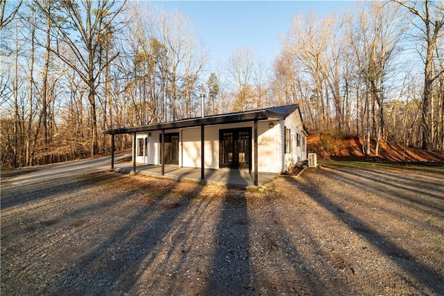 view of outbuilding featuring covered porch